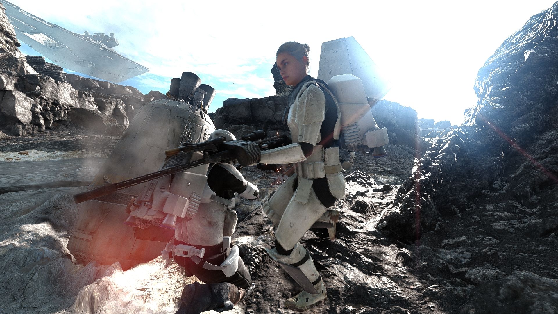 Two stormtroopers looking over one another's backs with weapons loaded.